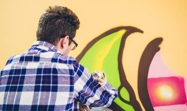 istock Man drawing street art graffiti 1133736087