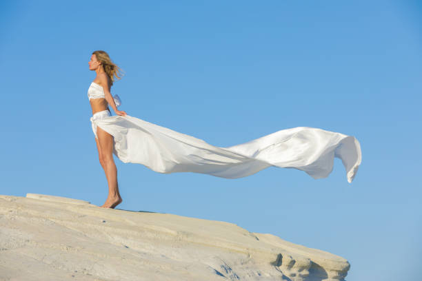 istock Beautiful Woman at the Beach 1133736102