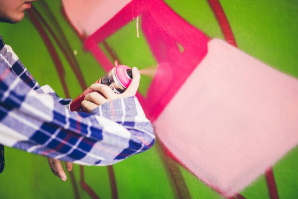 istock Man drawing street art graffiti 1133736805