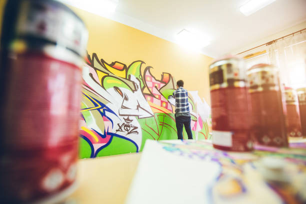 istock Man drawing street art graffiti 1133736834