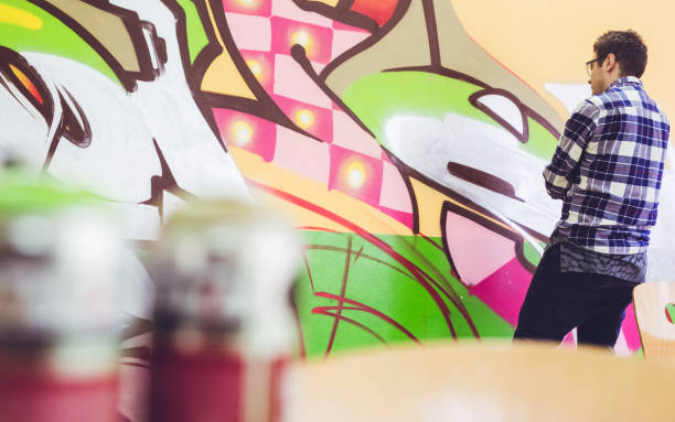 istock Man drawing street art graffiti 1133736920