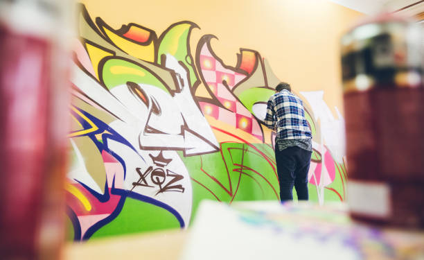 istock Man drawing street art graffiti 1133737017