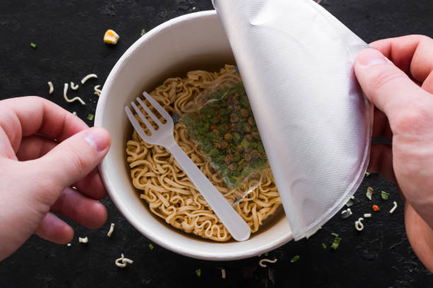 istock opens pack of instant noodles on black background 1133738507