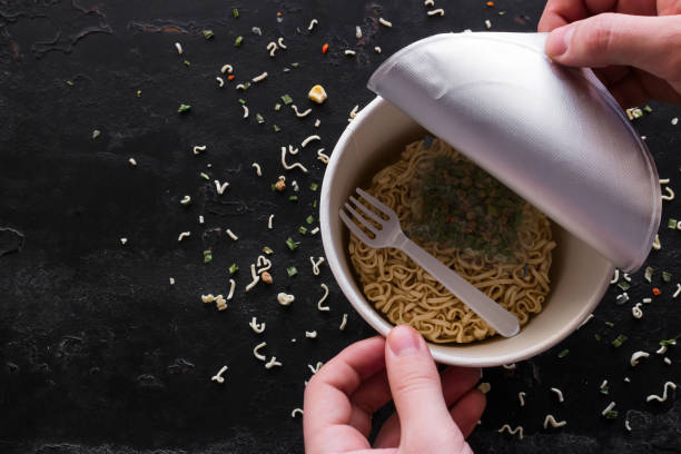 istock opens instant noodles on a black background with space for text 1133738529