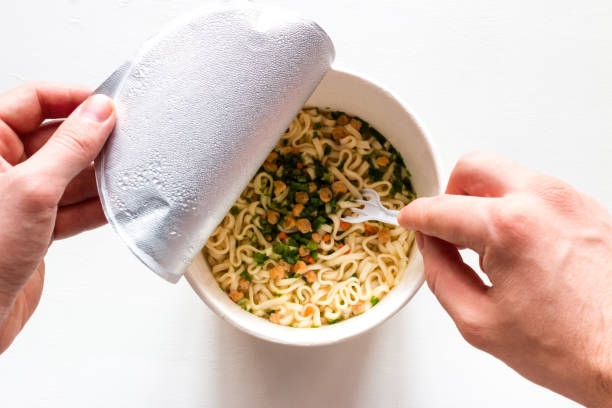 istock eating cooked instant noodles on a white background 1133738545
