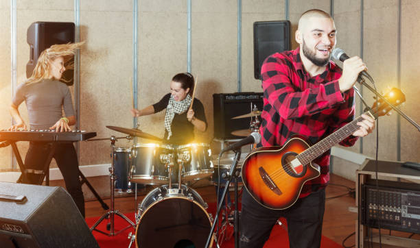 istock Emotional guy with guitar rehearsing 1133741178