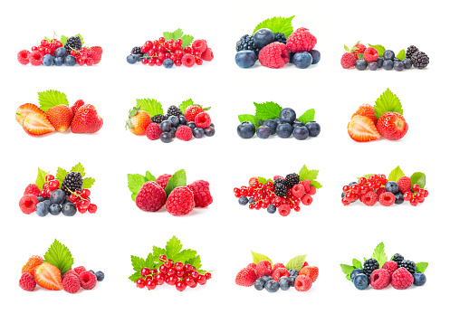 Healthy fresh food. Different berries collage set. Macro shots of fresh raspberries, blueberries, blackberries, strawberries, red currant and blackberries with leaves isolated on white background