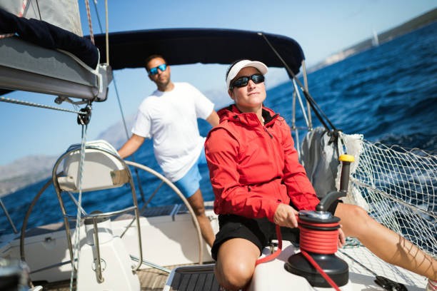 istock Attractive strong woman sailing with her boat 1133743479