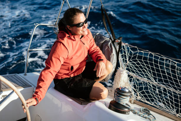 istock Attractive strong woman sailing with her boat 1133743496