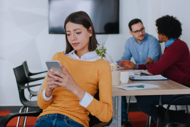 istock Young businesswoman using smart phone in the office 1133745089