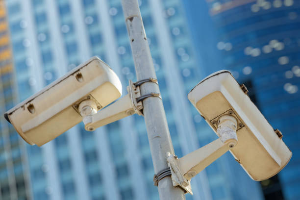 istock Modern CCTV camera with business buildings in the background 1133745765