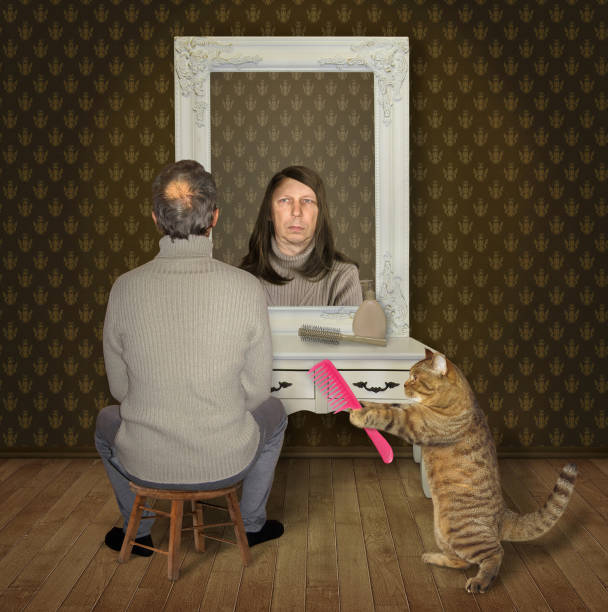 istock Man and his cat with a comb 1133747854