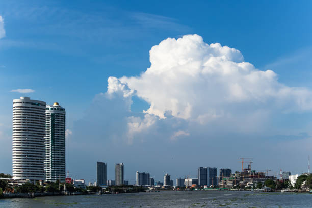 the chao phraya river and the city with cloud and blue sky, bangkok  is the capital and most populous city of the kingdom of thailand, the world's top tourist destinations - bangkok province photography construction architecture imagens e fotografias de stock