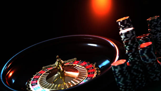 istock Casino background, poker Chips on gaming table, roulette wheel in motion, 1133749632