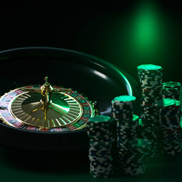 istock Casino background, poker Chips on gaming table, roulette wheel in motion, 1133750406