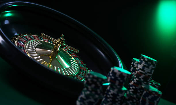 istock Casino background, poker Chips on gaming table, roulette wheel in motion, 1133750470