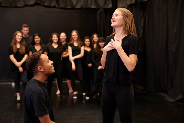 istock Male And Female Drama Students At Performing Arts School In Studio Improvisation Class 1133752369