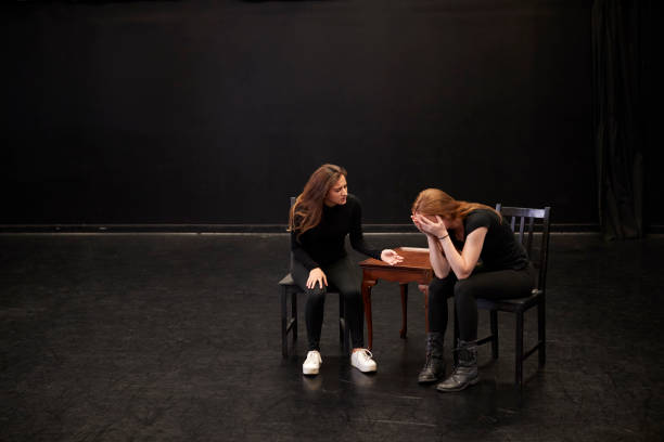Two Female Drama Students At Performing Arts School In Studio Improvisation Class Two Female Drama Students At Performing Arts School In Studio Improvisation Class rehearsal photos stock pictures, royalty-free photos & images