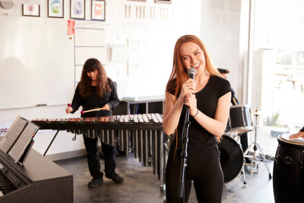 istock Students At Performing Arts School Playing In Band At Rehearsal 1133753044