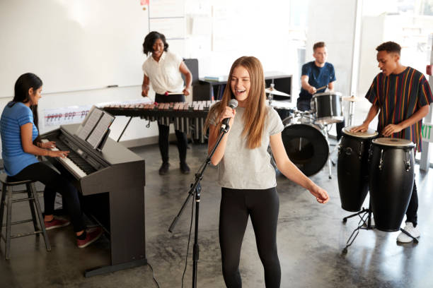 istock Students At Performing Arts School Playing In Band At Rehearsal 1133753088