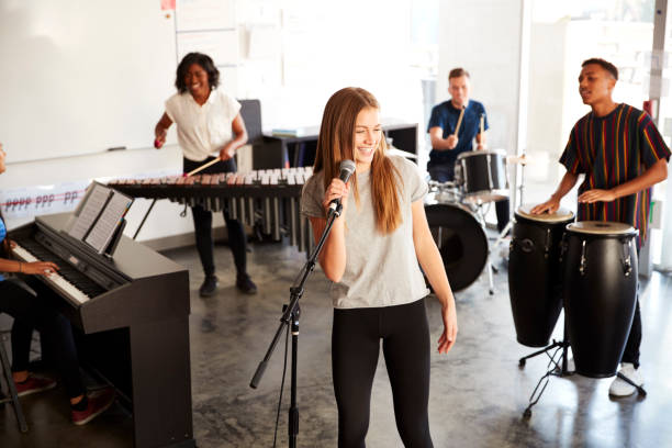 istock Students At Performing Arts School Playing In Band At Rehearsal 1133753089