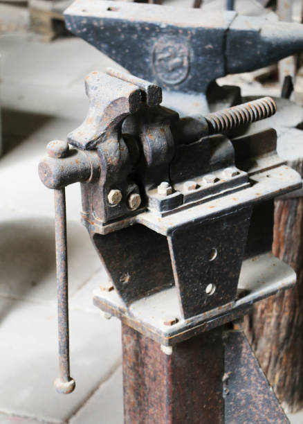 istock Old clamps on a wooden workbench 1133753335