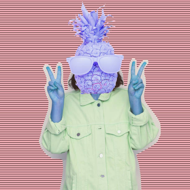 istock Female alien model with the big pineapple in sunglasses instead head on psychedelic stripes background. 1133754324