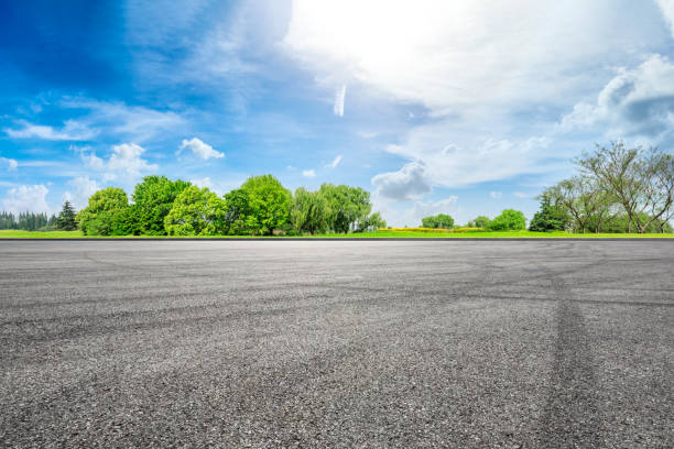 istock Empty asphalt race track ground and green forest in summer 1133754508