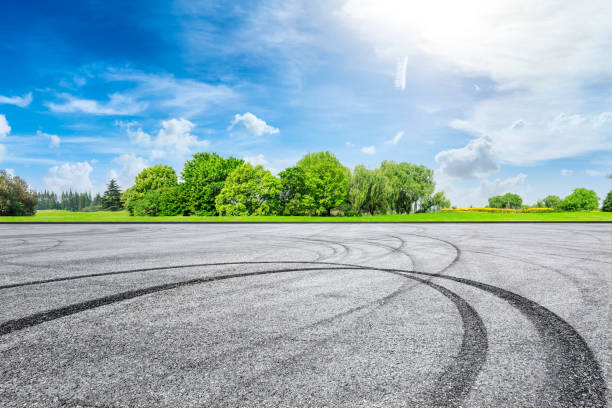 istock Empty asphalt race track ground and green forest in summer 1133754546