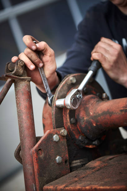 istock A young farmer repairing farmer equipment 1133754573
