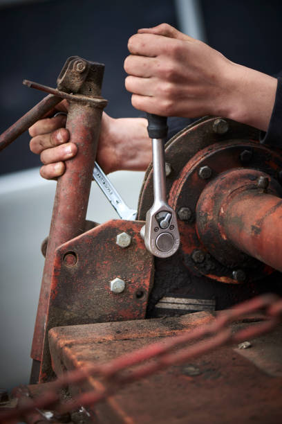 istock A young farmer repairing farmer equipment 1133754653
