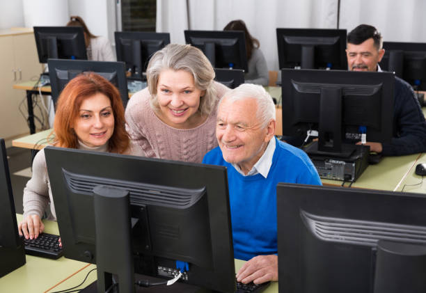 istock Students of different ages looking at monitor 1133754859
