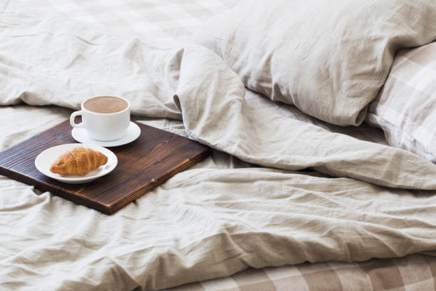 istock coffee on  tray on the bed in bedroom 1133757374