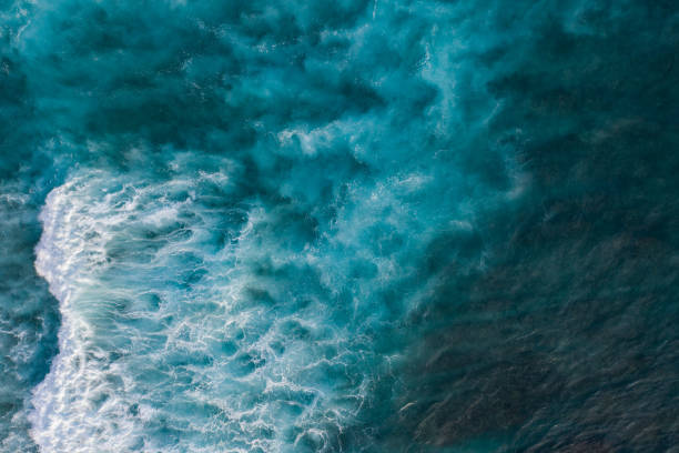 Ocean surf from above Water surface background. Aerial drone shot turquoise ocean stock pictures, royalty-free photos & images