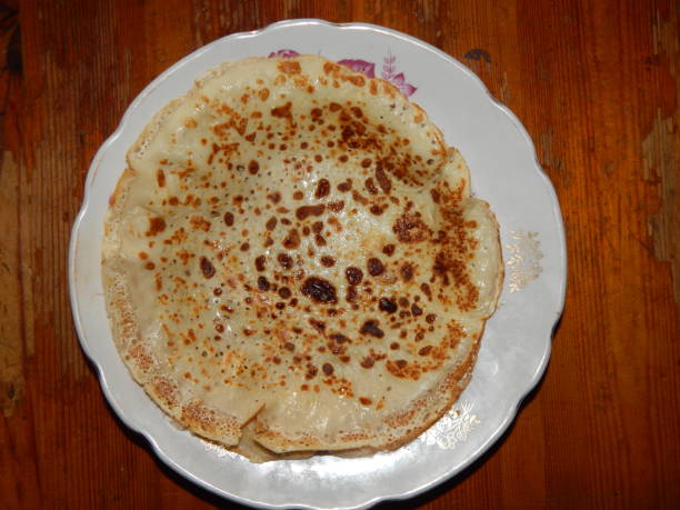 istock Pancakes on a new cast-iron skillet on Shrovetide 1133759871