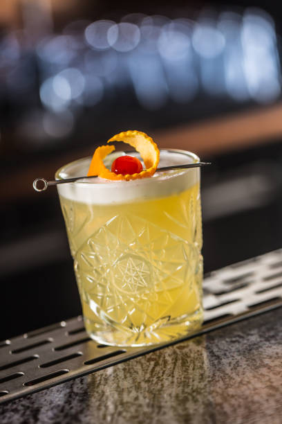 istock Cocktail drink whiskey sour at barcounter in night club or restaurant 1133760175