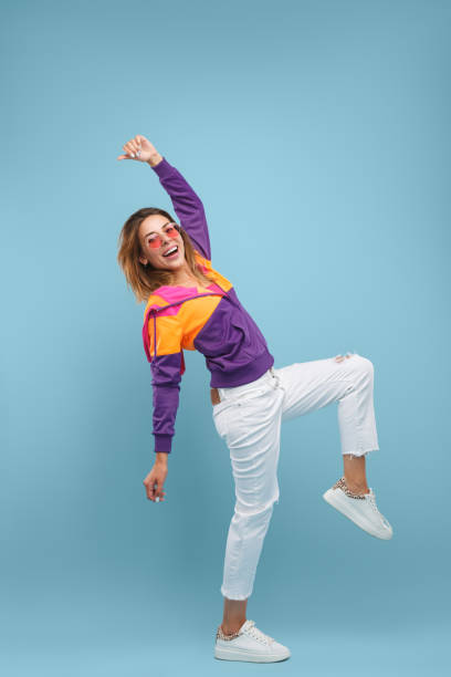istock Cheerful woman dancing and looking at camera 1133760202