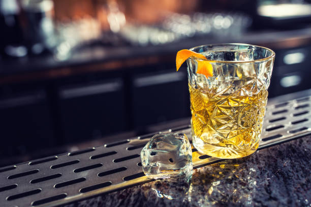 istock Cocktail drink old fashioned at barcounter in night club or restaurant 1133760214