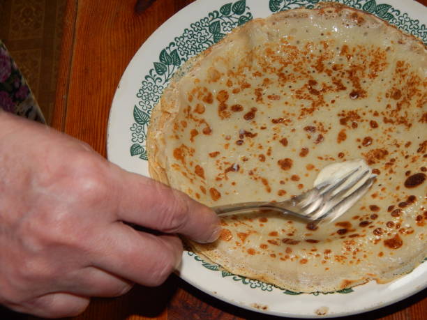 istock Pancakes on a new cast-iron skillet on Shrovetide 1133760493