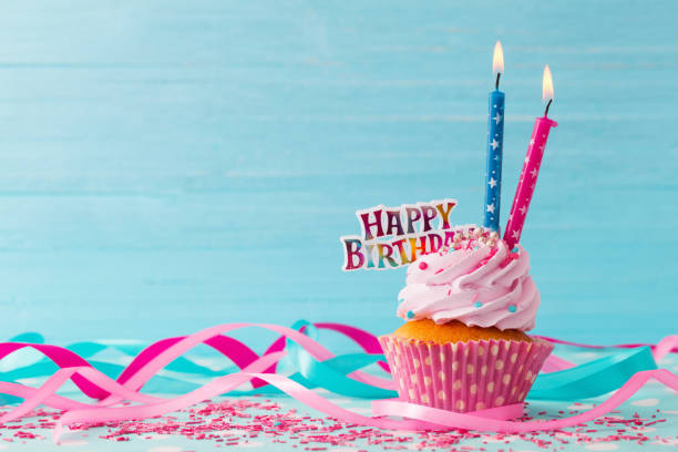 istock birthday cake on blue wooden background 1133760911