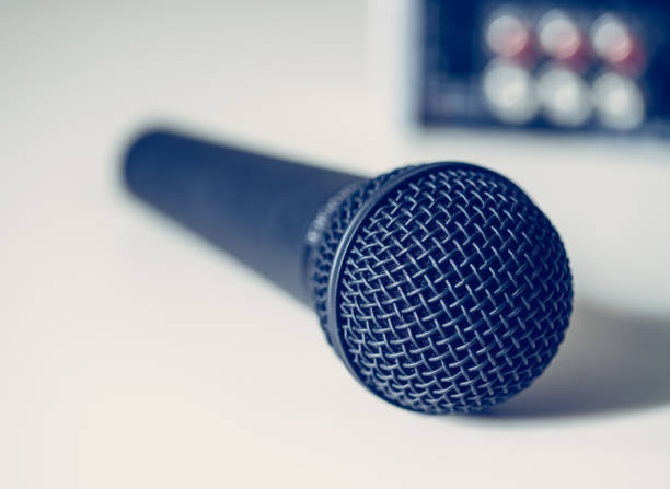 istock Black microphone and mixer in the blurry background 1133762388