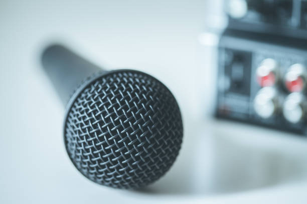 istock Black microphone and mixer in the blurry background 1133762389
