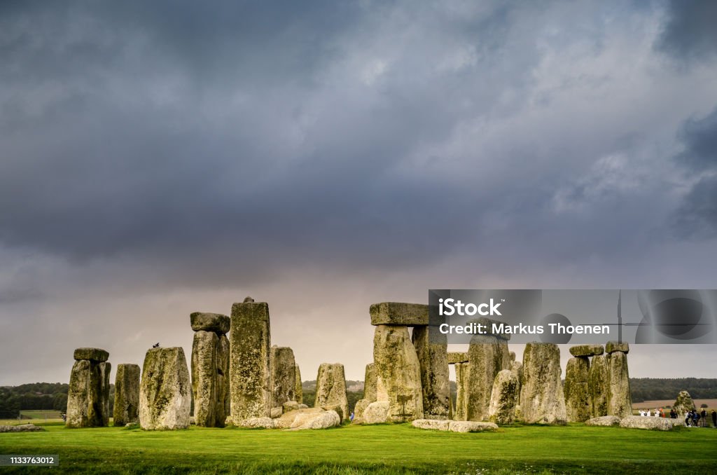 Dusk with storm clouds, Stonehenge, United Kingdom Dusk with thunderclouds, Stonehenge, United Kingdom Stonehenge Stock Photo