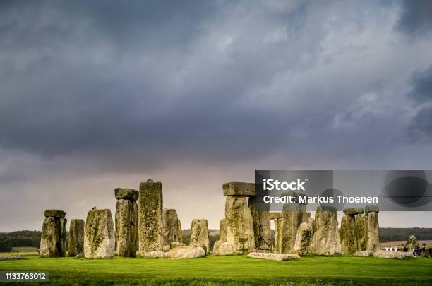 Dusk With Storm Clouds Stonehenge United Kingdom Stock Photo - Download Image Now - Stonehenge, Summer Solstice, Winter Solstice