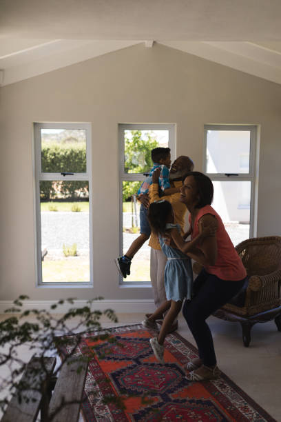 istock Multi-generation family having fun in living room 1133767304