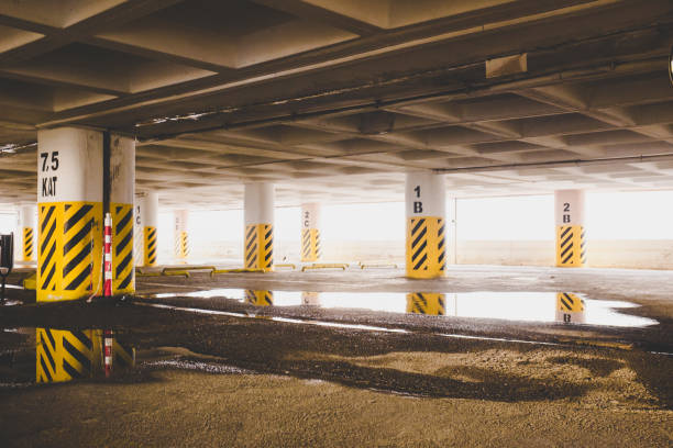 istock Arrows point the way inside of a city parking structure 1133767453