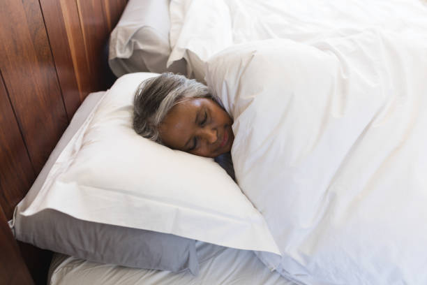 istock Senior woman sleeping in bedroom at home 1133767554