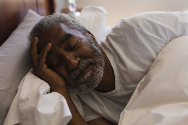 istock Senior man sleeping in bedroom at home 1133767591