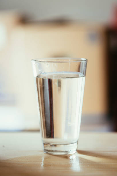 istock Glass of fresh cold water, blurry background 1133769047