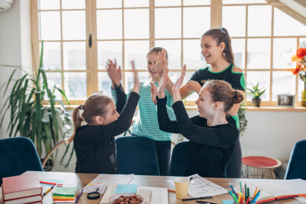 istock Girls students having fun on class in private school 1133769322